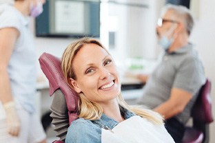 Woman smiling in the dental chair