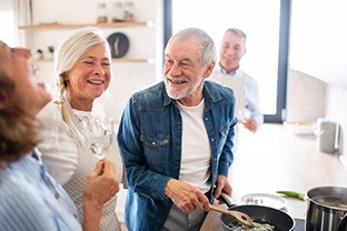 Dentures patient in Peabody talking with friends