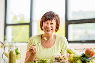 Dentures patient in Peabody eating healthy food