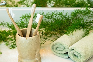 Toothbrushes in a clay cup