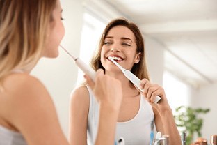 Woman brushing her teeth