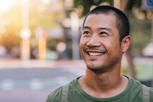 Man smiling outside