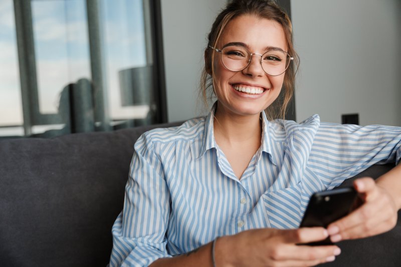 person with a dental bridge smiling