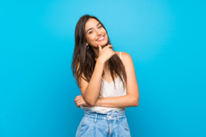 Woman striking a sassy pose and smiling